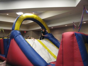 Photo by Ms. R. Gina Renee. Sophomore Lainie Kaseff (left) and freshman Ariel Brudoley tested out the obstacle course before the carnival began.