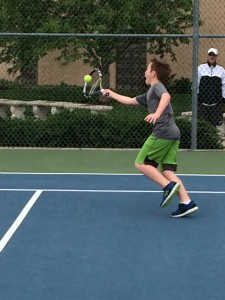 Photo courtesy of Matt Kavanaugh. Fifth grader Mathew Saper serves the ball.