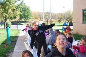 Photo by Alexis Davis. Upper school STUCO's annual "Hotdog in the Hut" lunch is one of many Sukkot highlights.