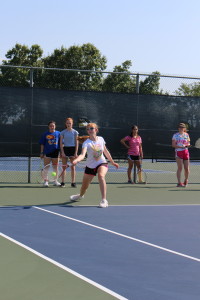 Sophomore Molly Kavanaugh perfects her serve. Photo by Alexis Davis.
