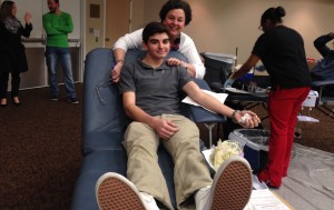 Justin's mom, Carol Pfau, is proud of her son's commitment to giving blood. Photo by Elana Goldenberg.