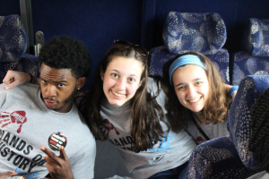 From left: Will Powell (UA), Julia Paul (HBHA), and Eliana Schuster (HBHA) pose for a picture on the bus in Selma, Ala.. Photo by Eliana Saidel.